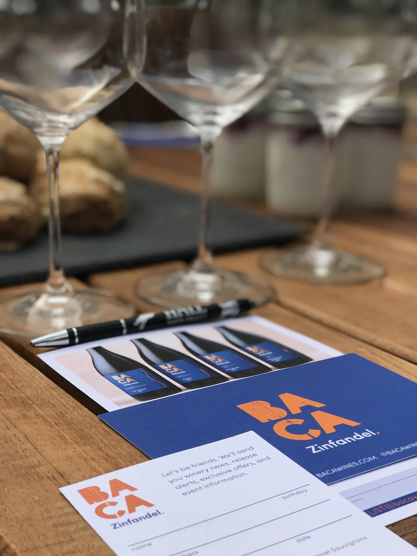 A BACA tasting sheet set out under a row of empty wine glasses