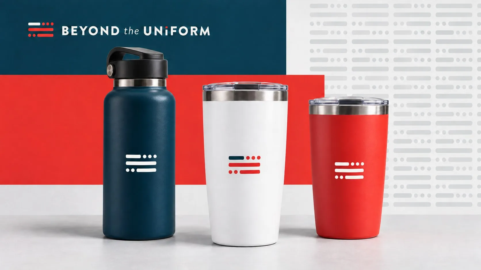 A navy bottle, a white tumbler and a red tumbler with the flag